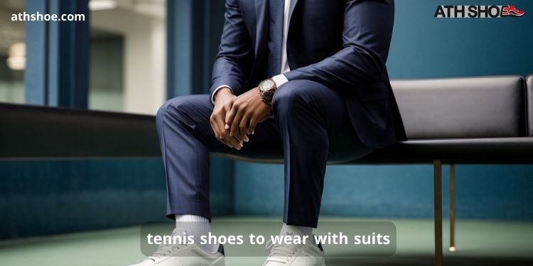 A picture of a man wearing sneakers sitting on a chair as part of a discussion about tennis shoes to wear with suits in Australia